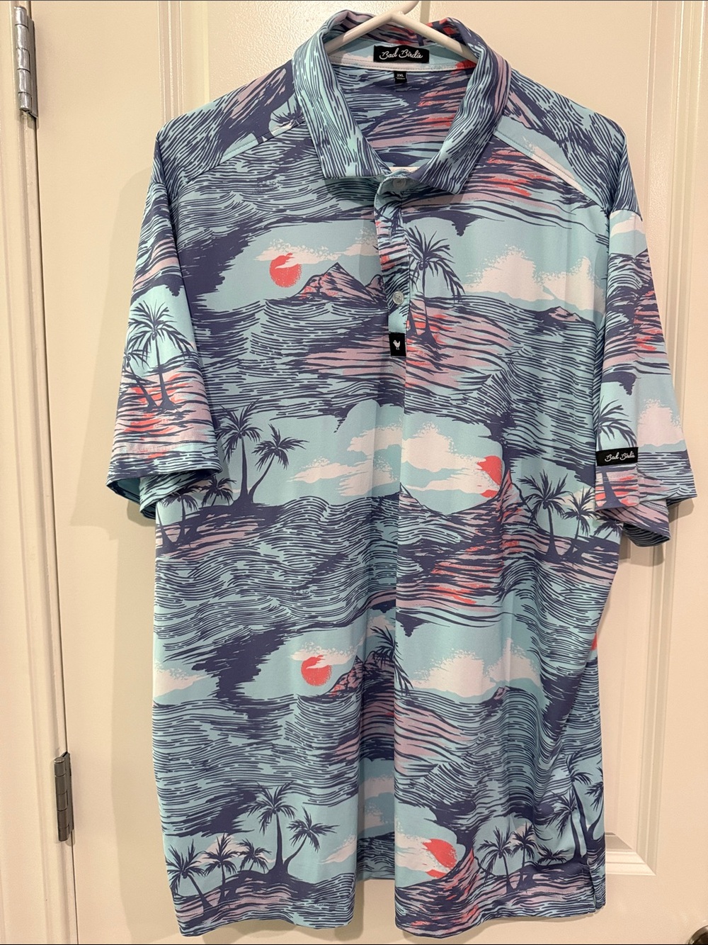 Bad Birdie Men’s Light Blue Polo with Pink and Navy Tropical Print